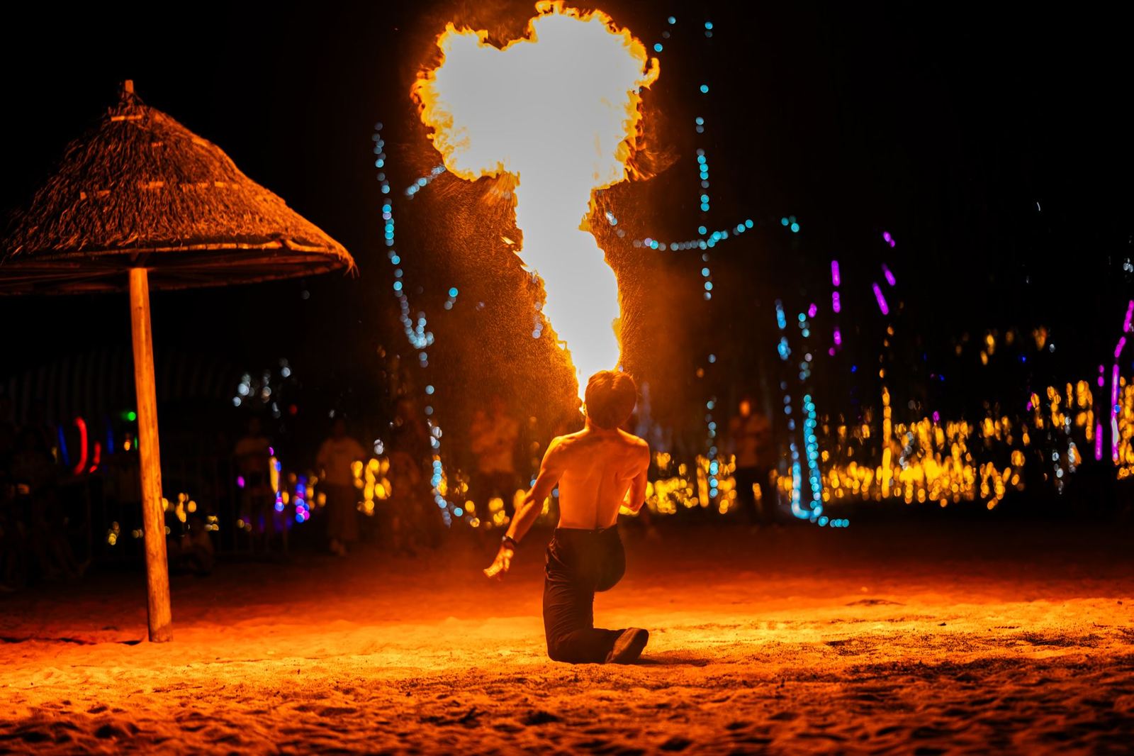 A fire show on the sand at night on Sairee Beach, Koh Tao